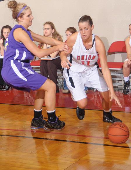 Kaitlin Dudley, senior physical education and health major, drives to the basket in Game 1 of the NAIA Women's Basketball National Tournament against Southwestern Assemblies of God University. The Lady Bulldogs won 86-47.  - Photo by Morris Abernathy