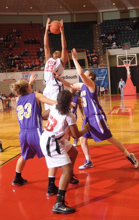 Ashley Lillard, junior psychology major, rebounds the ball in Game 1 of the NAIA Women's Basketball National Tournament against Southwestern Assemblies of God University. The Lady Bulldogs won 86-47.   - Photo by Morris Abernathy