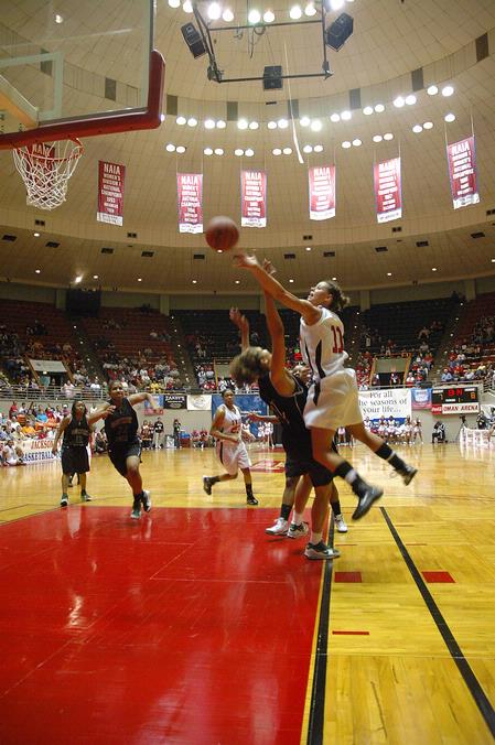 Kaitlin Dudley, senior physical education and health major, goes up for a shot against Southern Polytechnic State University in the Second Round of the NAIA National Tournament. - Photo by Jordan Buie