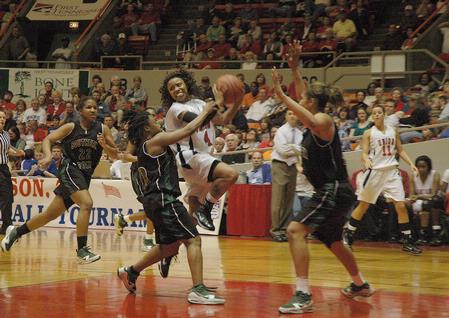 Jessica Graves, senior journalism major, battles for the ball against Southern Polytechnic State University in the Second Round game of the NAIA National Tournament. The Lady Bulldogs won 70-47. - Photo by Jordan Buie