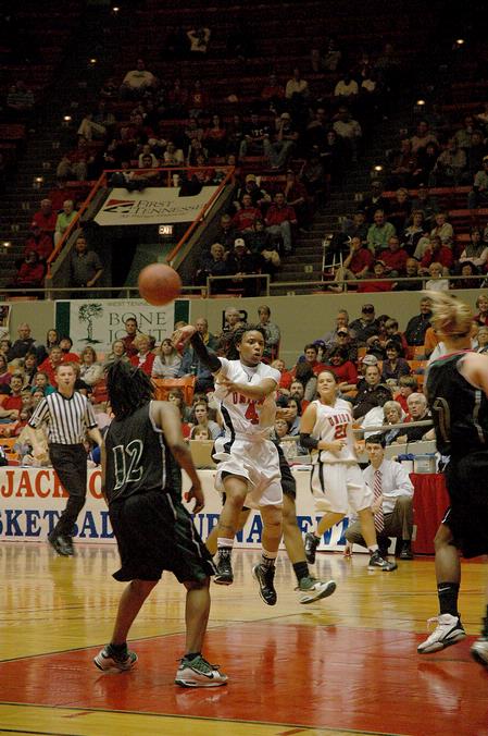 Jessica Graves, senior journalism major, passes the ball to a teammate in the Second Round game of the NAIA National Tournament against Southern Polytechnic State University. The Lady Bulldogs won 70-47. - Photo by Jordan Buie