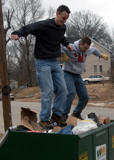 Ben Mandrell (left) and Mark VanderHaar give it their all while on clean up duty at The Care Center during Martin Luther King Jr. service day.  - Photo by Jim Veneman
