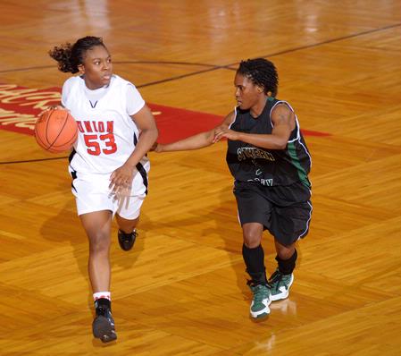 Lavanda Ross, sophomore accounting major, dribbles down the court in the Second Round game of the NAIA National Tournament against Southern Polytechnic State University. The Lady Bulldogs won 70-47. - Photo by Morris Abernathy