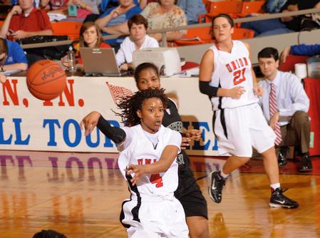 Jessica Graves, senior journalism major, makes a pass in the Second Round game of the NAIA National Tournament against Southern Polytechnic State University. The Lady Bulldogs won 70-47. - Photo by Morris Abernathy