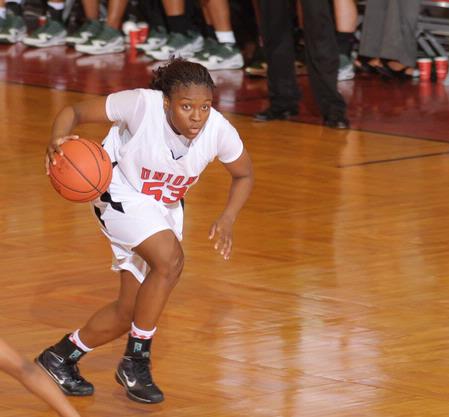 Lavanda Ross, sophomore accounting major, dribbles down the court in the Second Round game of the NAIA National Tournament against Southern Polytechnic State University. The Lady Bulldogs won 70-47. - Photo by Morris Abernathy