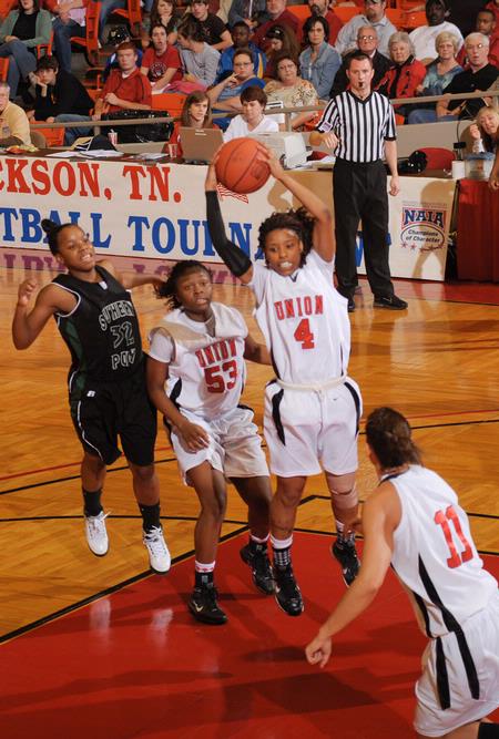 Jessica Graves, senior journalism major, grabs a rebound in the Second Round game of the NAIA National Tournament against Southern Polytechnic State University. The Lady Bulldogs won 70-47. - Photo by Morris Abernathy