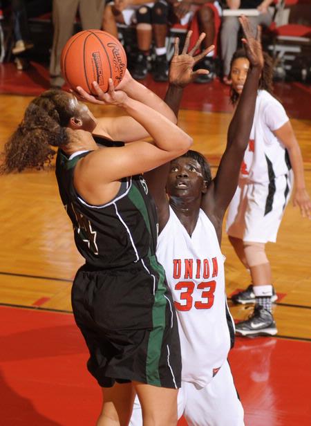 Zeinab Chan, junior history major, goes up to block a shot by Southern Polytechnic State University in the Second Round game of the NAIA National Tournament. The Lady Bulldogs won 70-47. - Photo by Morris Abernathy