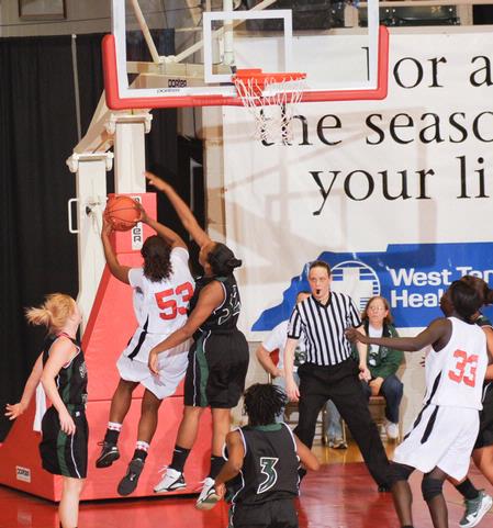 Lavanda Ross, sophomore accounting major, goes up for a lay-up in the Second Round game of the NAIA National Tournament against Southern Polytechnic State University. The Lady Bulldogs won 70-47. - Photo by Morris Abernathy