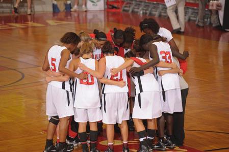 The Lady Bulldogs have a team prayer before beginning the Quarterfinals game of the NAIA National Tournament. - Photo by Morris Abernathy