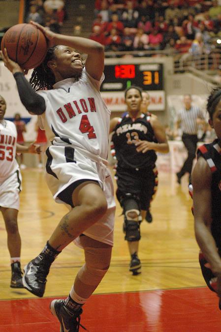 Jessica Graves, senior journalism major, goes up for a layup in the Championship game of the NAIA National Tournemnt against Azusa Pacific. The Lady Bulldogs won the tournament for the second year in a row 73-65. - Photo by Jordan Buie