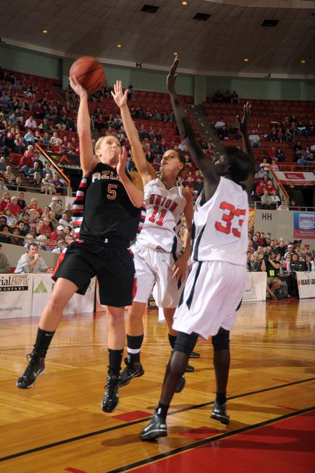 Kaitlin Dudley, senior physical education and health major, and Zeinab Chan, junior history major, play defense against their Azusa Pacific University opponent during the Championship game of the NAIA National Tournament. The Lady Bulldogs won the game 73-65. - Photo by Morris Abernathy