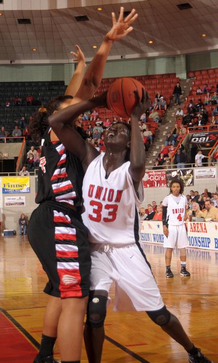 Zeinab Chan, junior history major, goes up for a shot in the Championship game of the NAIA National Tournament. The Lady Bulldogs defeated Azusa Pacific University 73-65. - Photo by Morris Abernathy