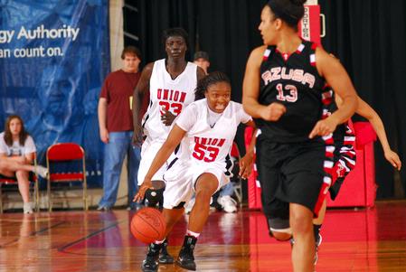 Lavanda Ross, sophomore accounting major, dribbles down the court during the Championship game of the NAIA National Tournament. The Lady Bulldogs defeated Azusa Pacific Univeristy 73-65. - Photo by Morris Abernathy