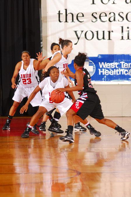 Ashley Lillard, senior, Lavanda Ross, sophomore, and Kaitlin Dudley, senior, defend against Azusa Pacific University in the Championship game of the NAIA National Tournament. The Lady Bulldogs won the game 73-65. - Photo by Morris Abernathy