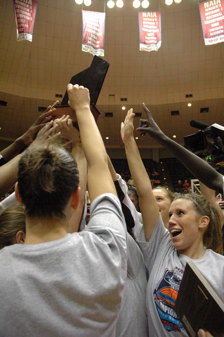 The Lady Bulldogs celebrate with their trophy after becoming NAIA Division I champions for the second year in a row. - Photo by Jordan Buie