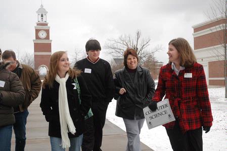 Student Ambassador Rebecca Eaton takes prospective students Carey Suter (left) from Greenbrier, Tenn., and Steven Coffelt, from Tullahoma, Tenn., and their parents to meet with department professors during a Preview Day at Union. - Photo by Beth Spain