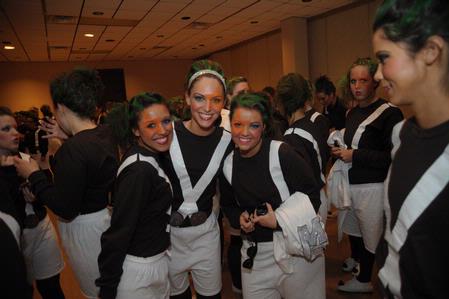 The women of Chi Omega, dressed as Oompa Loompas stop for a picture before Variety Show 2010. Chi Omega's group won best costumes for the show.  - Photo by Morris Abernathy