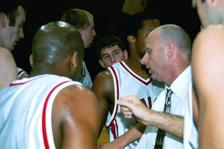 Union head Coach Ralph Turner gives instructions during a time-out. - Photo by Jim Veneman