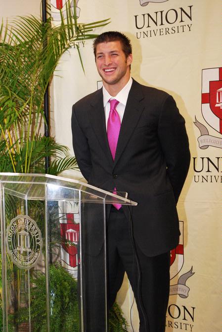 Tim Tebow answers questions at a press conference held before the Roy L. White Golf and Gala banquet. - Photo by Abigail Harris