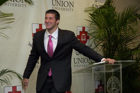 Tim Tebow answers questions at a press conference held before the Roy L. White Golf and Gala banquet. - Photo by Lauren Laster