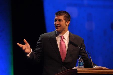 Tim Tebow speaks at the Roy L. White Legacy Golf and Gala event. Tebow encouraged guests with his story and urged everyone to "finish strong." - Photo by Morris Abernathy