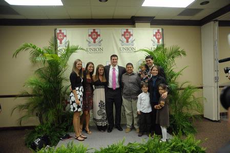 Tim Tebow, keynote speaker at the Roy L. White Legacy Golf and Gala, poses with guests after the event. - Photo by Morris Abernathy