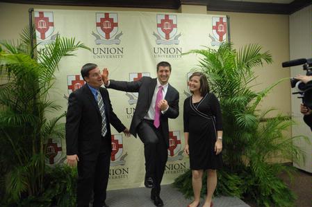 Tim Tebow, keynote speaker at the Roy L. White Legacy Golf and Gala, has a laugh with guests after the event. - Photo by Morris Abernathy