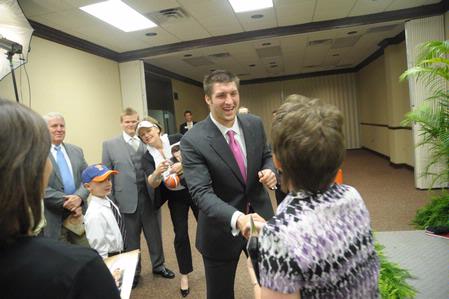 Tim Tebow, keynote speaker at the Roy L. White Legacy Golf and Gala, greets guests after the event. - Photo by Morris Abernathy