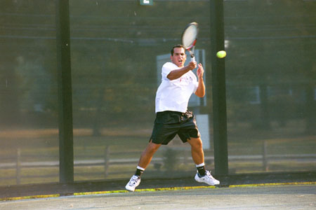 Christiano Castro returns a shot during practice.
 - Photo by Kristen Hiller