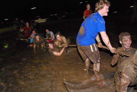Students play and intense game of tug-of-war at Midnight Mudness sponsored by Young Alums.  - Photo by Abigail Harris