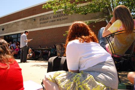 Jordan Buie reads a creative writing piece that he wrote at the annual Scholarship Symposium. - Photo by Abigail Harris