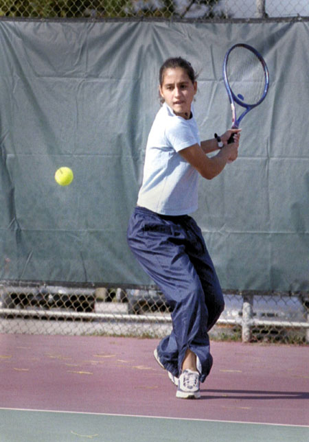 Paula Coutinho returns a shot during practice. - Photo by Kristen Hiller