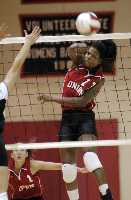 Junior Gladys Wandera goes for the kill in a match versus Christian Brothers.  Union won 3-0. - Photo by Jim Veneman