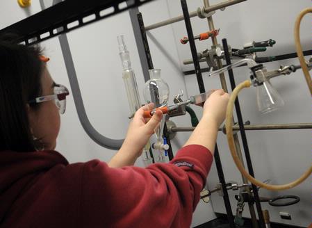 Students work on a chemistry experiment in lab. - Photo by Morris Abernathy