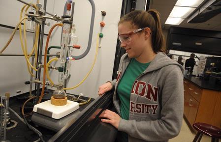 Students work on a chemistry experiment in lab. - Photo by Morris Abernathy