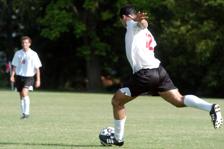 Freshman Fabio Buarque (12) winds up for a powerful kick during a recent game. - Photo by Jonathan Blair