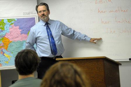 Dr. John Netland, professor of English and department chair, teaches a class.  - Photo by Morris Abernathy