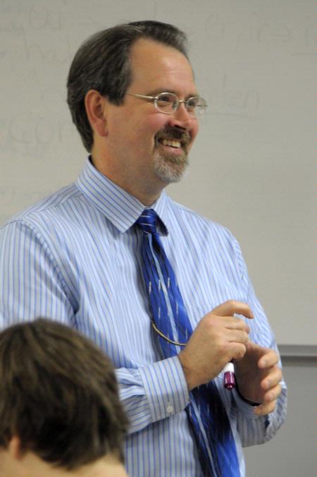 Dr. John Netland, professor of English and department chair, teaches a class.  - Photo by Morris Abernathy