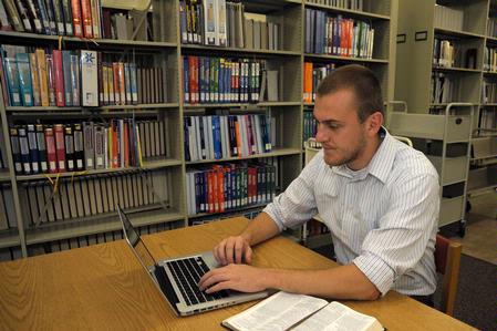John Winfree, junior Christian studies major, studies in the library. - Photo by Morris Abernathy