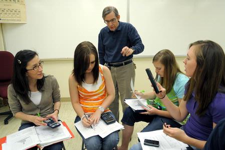 Dr. David Ward, professor of physics, helps students with some class work. - Photo by Morris Abernathy