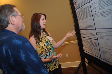 Chemistry major Jill Frank presents her semester long project at the annual scholarship symposium. - Photo by Morris Abernathy
