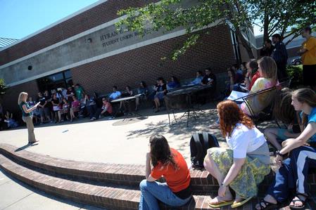 English majors presented their semester long projects outside Barefoots Joe for the annual scholarship symposium. - Photo by Morris Abernathy