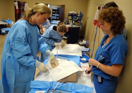Nursing students work on simulations in Providence Hall. - Photo by Morris Abernathy
