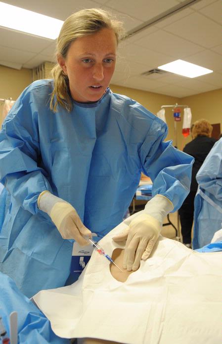 Nursing students work on simulations in Providence Hall. - Photo by Morris Abernathy
