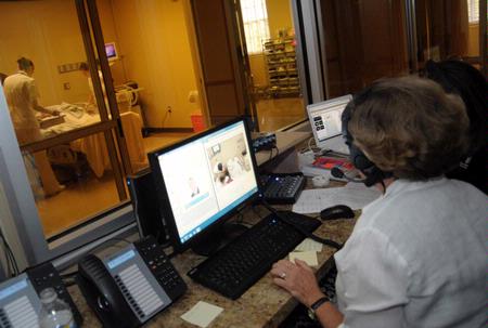 Nursing students work on simulations in Providence Hall as their professors run the control room. - Photo by Morris Abernathy
