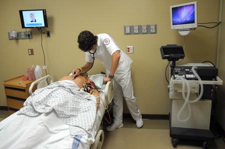 Nursing students work on simulations in Providence Hall. - Photo by Morris Abernathy