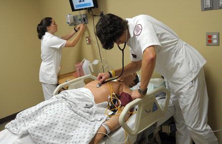 Nursing students work on simulations in Providence Hall. - Photo by Morris Abernathy
