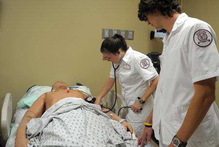Nursing students work on simulations in Providence Hall. - Photo by Morris Abernathy