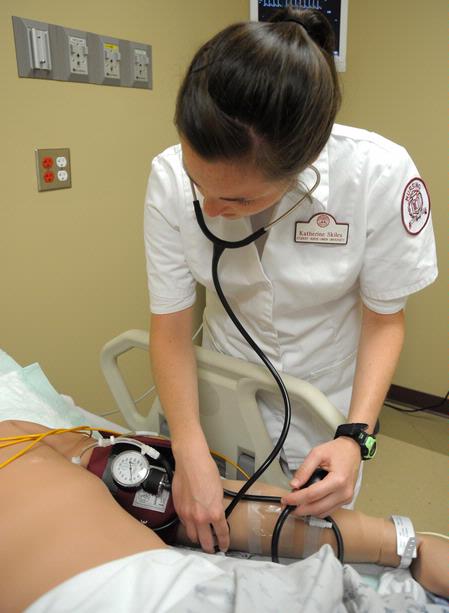 Nursing students work on simulations in Providence Hall. - Photo by Morris Abernathy