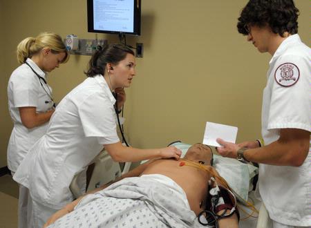 Nursing students work on simulations in Providence Hall. - Photo by Morris Abernathy